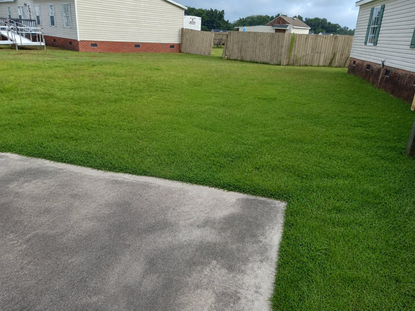 Clear lawn and clean concrete after construction debris removal